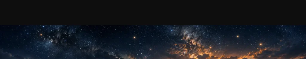 Mountain valley at sunrise beneath a star-filled sky with golden light reflecting across the water